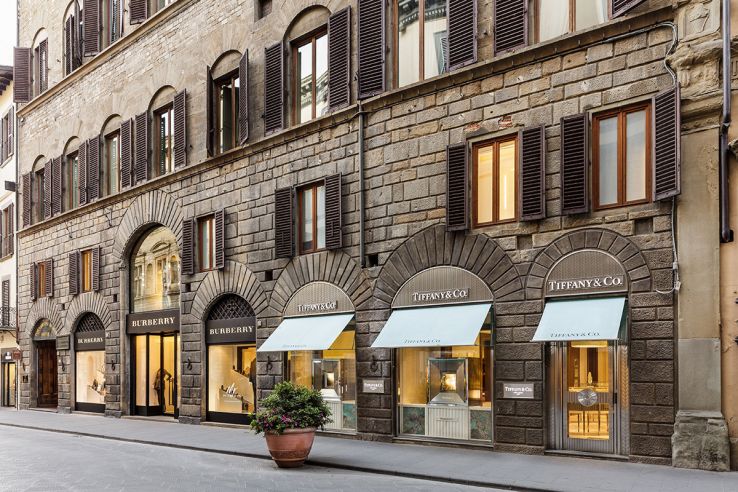 Louis Vuitton and the steps that lead up from the store in Via dei Mille in  Naples, Italy